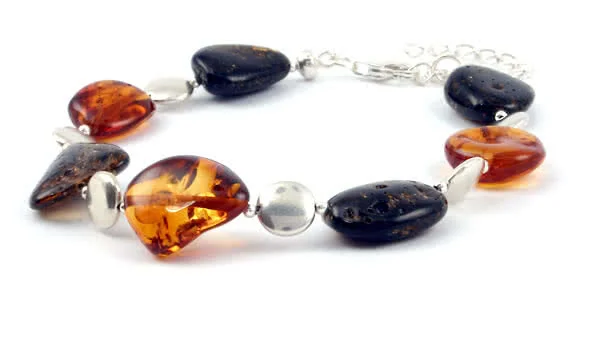 Seperated by tiny silver beads and round flat silver beads