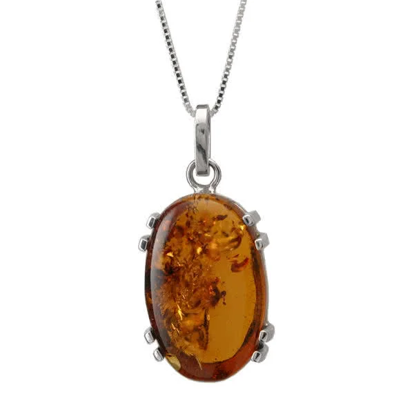 Handmade silver pendant holding a large piece of oval Baltic amber (32mm x 21mm)