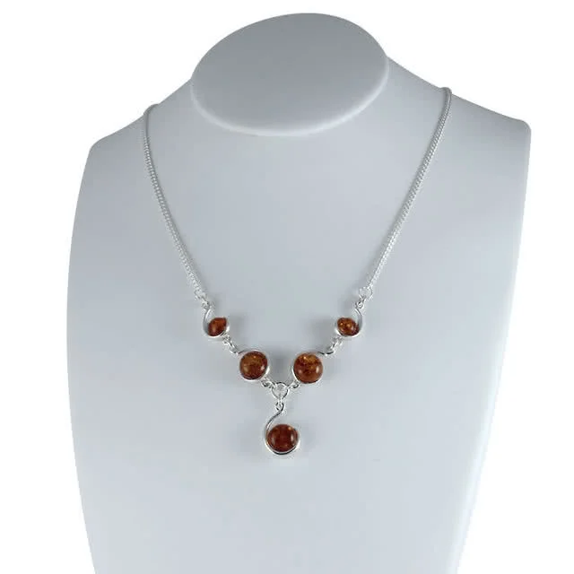 Amber Swirls Necklace - Set with five round pieces of amber