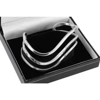 Triple Silver Highly polished wave bangle weighs an impressive 31 grams