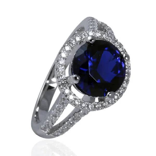 Blue Sapphire CZ Halo Ring - Finished with rhodium for a super reflective platinum look