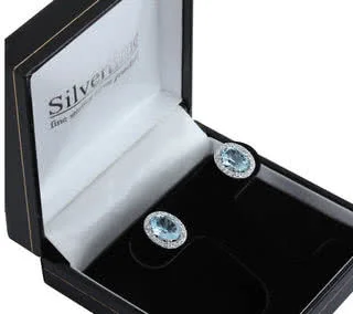 Rhodium Plated Oval Blue Topaz Earrings -  Overall size 11.40mm x 9.80mm