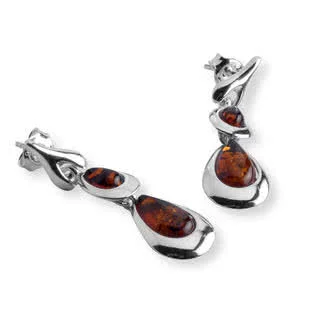 Teardrop shaped amber set into highly reflective polished sterling silver frame