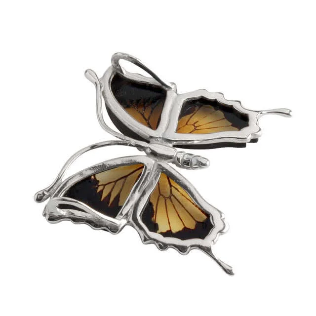 Specially selected flawless pieces of amber are used to create the wings