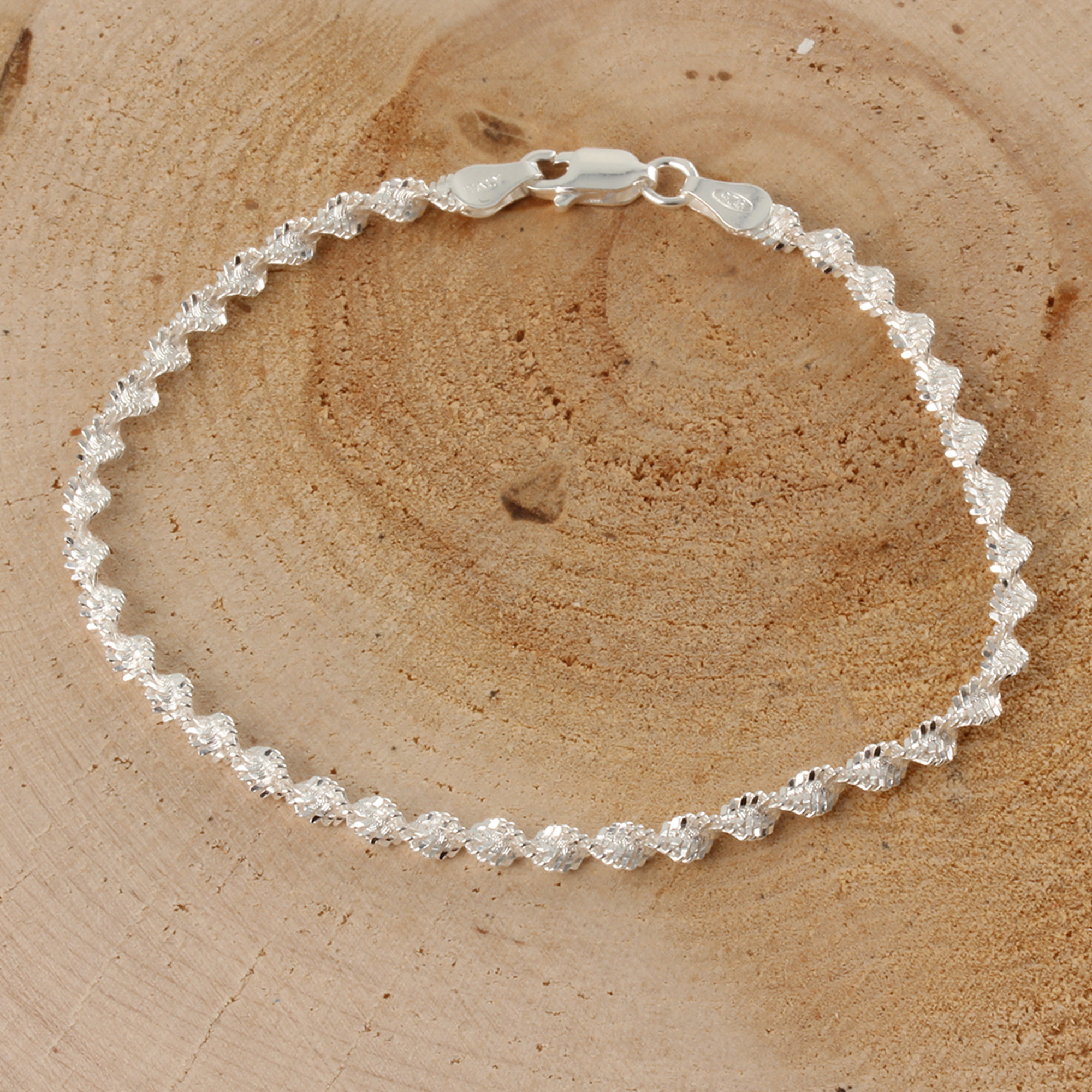 Silver Magic Twist Diamond Cut Bracelet Sparkles And Shimmers