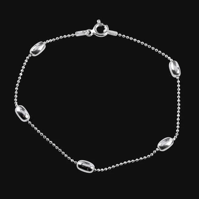Silver Diamond Cut Sparkle Bead Bracelet - Smooth polished oval beads are set along the bracelet