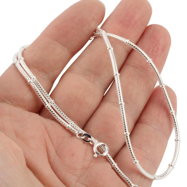 Snake chain with round stations, this chain has no gaps to tangle and catch your hair!