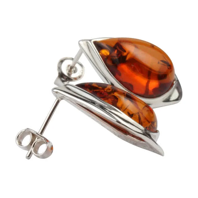 The pieces of amber measure 14mm x 10mm, wrapped in sterling silver