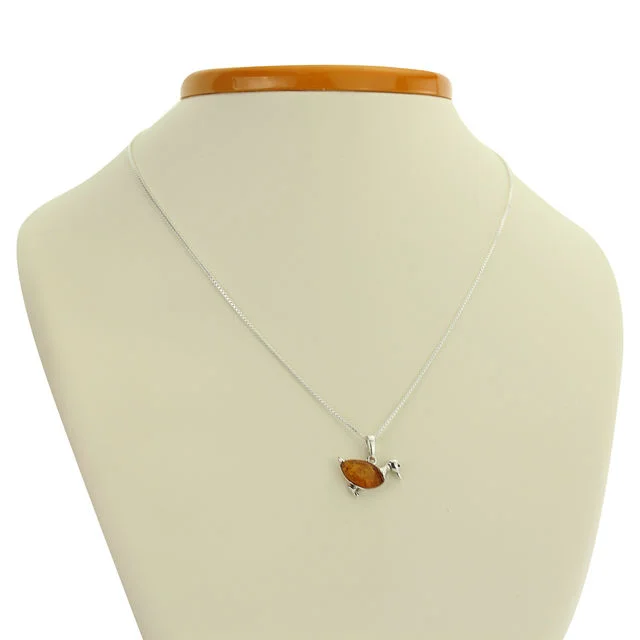 Polished Sterling Silver Honey Baltic Amber Duck Pendant On A Stand