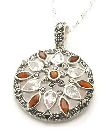 Round silver pendant set with genuine Marcasite and red and white Cubic Zirconia